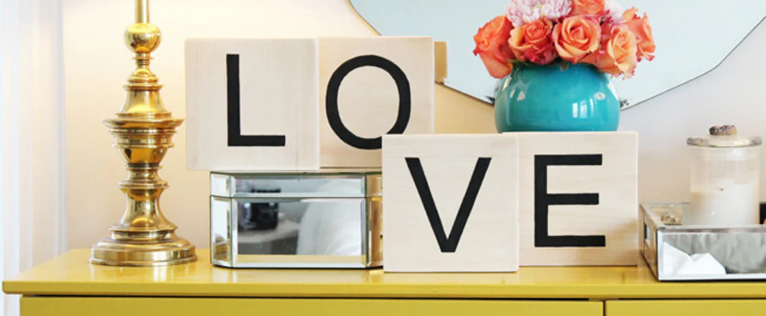 scrabble tiles that speill out the word "love"