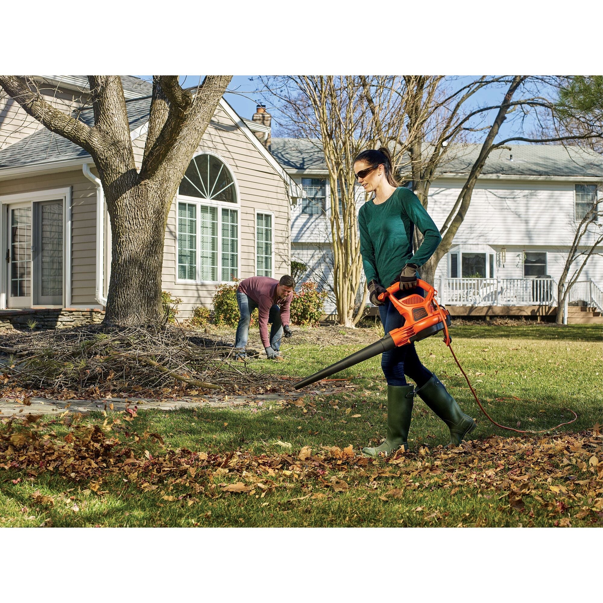 Woman using Black-and-decker leaf blower