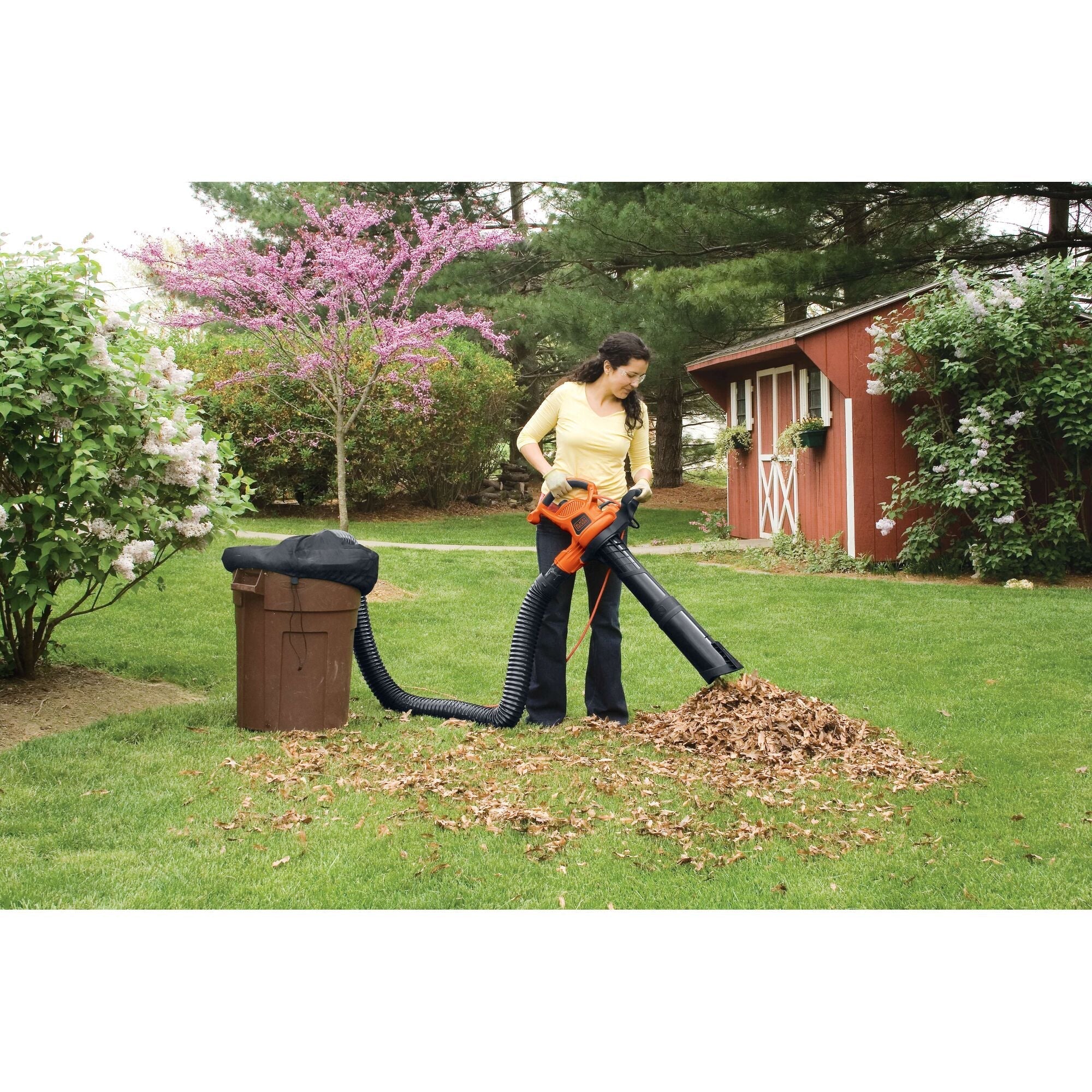Woman using Black-and-decker leaf vacuum