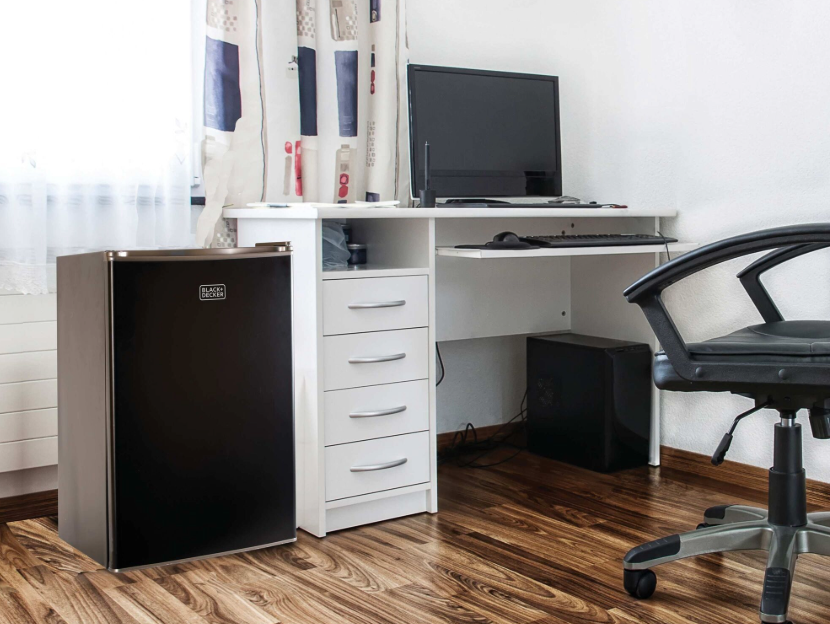 Black-and-decker mini fridge in a dorm room