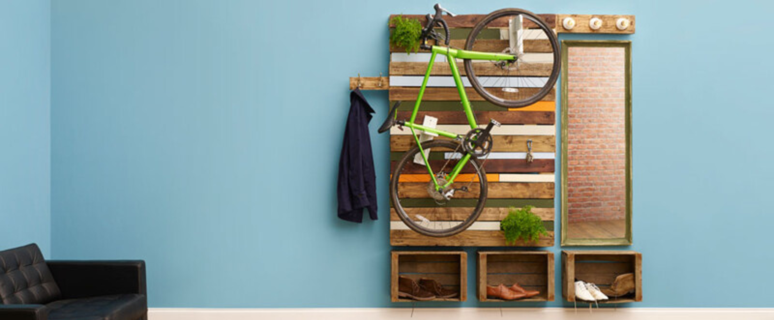Bike rack and shelves made of pallets hanging on wall