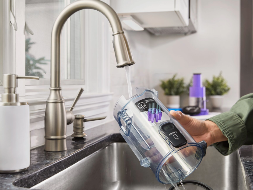 Black-and-decker dustbuster washable pieces under a faucet