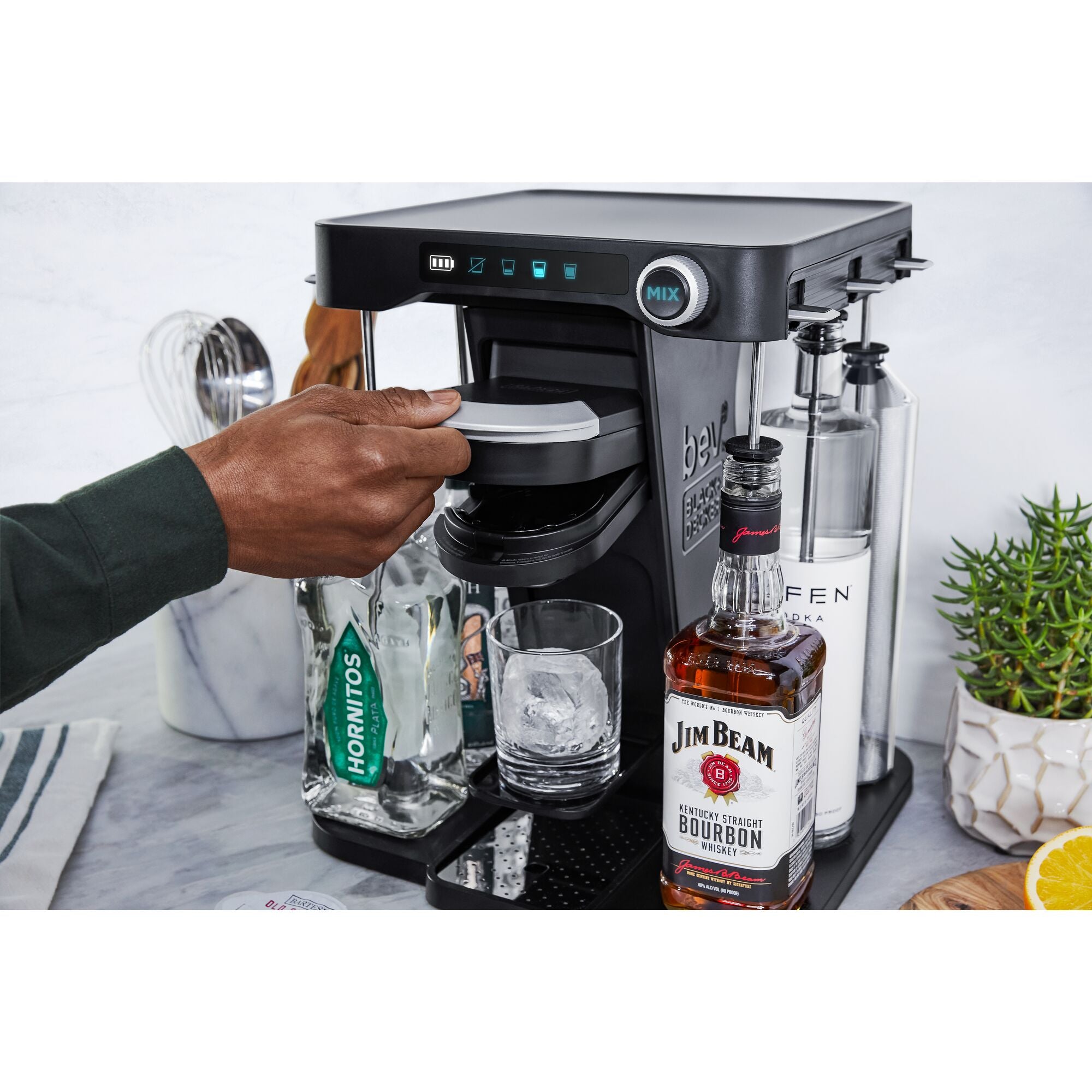overhead view of bev by Black-and-decker(TM) cordless cocktail maker with Jim Beam brand liquor bottles