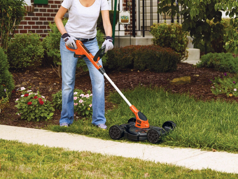 woman using Black-and-decker 3in 1 convertable string trimmer to lawn mower