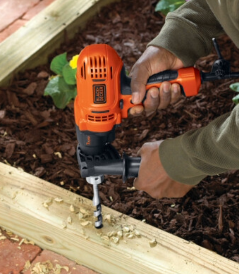 Black-and-decker hammer drill on wood
