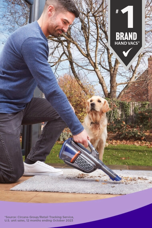 man using dustbuster hand vac